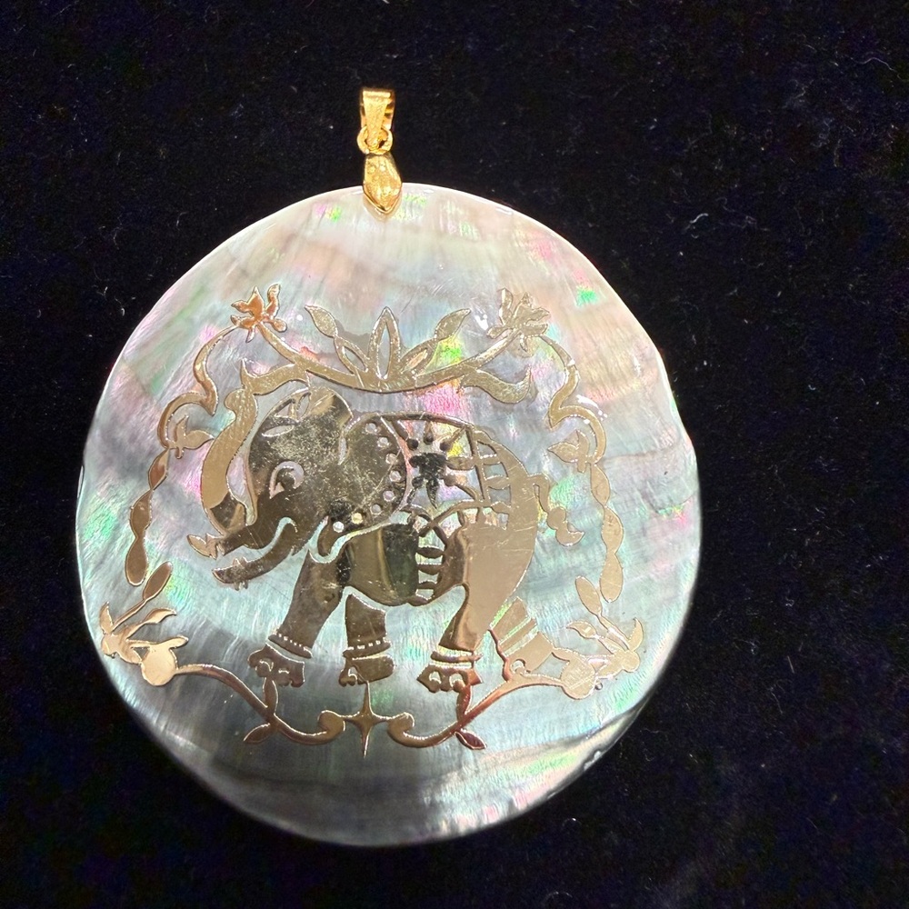 Gold Elephant Pendant on Iridescent Shell
